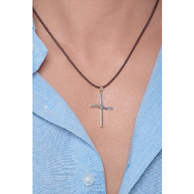 Minimal cross pendant in 18k white and yellow gold