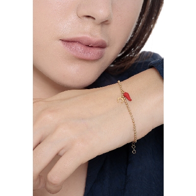 18K yellow gold bracelet with a red lucky horn and a horseshoe charm