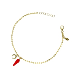 18K yellow gold bracelet with a red lucky horn and a horseshoe charm