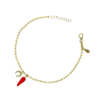 18K yellow gold bracelet with a red lucky horn and a horseshoe charm