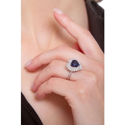 Halo ring with blue sapphire heart cut and diamonds white gold 18k