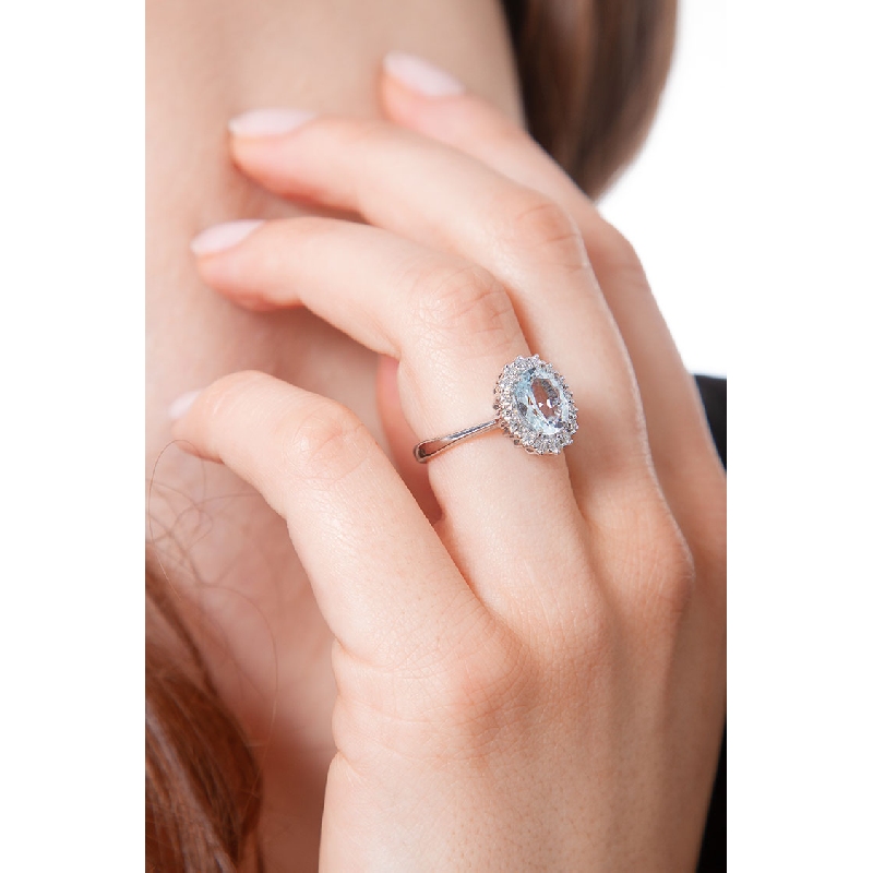 18k white gold diamond halo ring with aquamarine 18k white gold diamond halo ring with aquamarine
