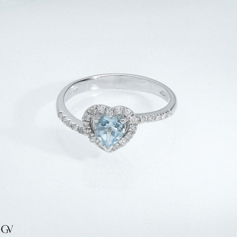 White gold 18k halo ring with aquamarine heart cut and diamonds  White gold 18k halo ring with aquamarine heart cut and diamonds