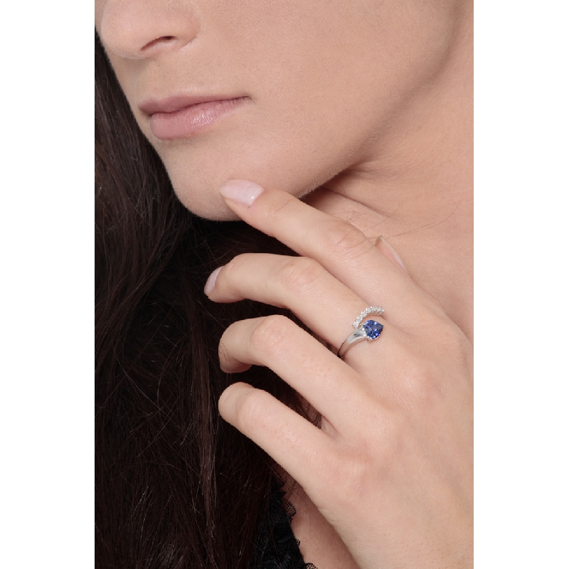 White gold ring with blue sapphire heart cut and a row of diamonds  White gold ring with blue sapphire heart cut and a row of diamonds