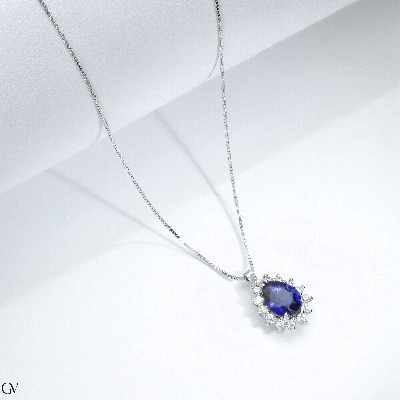 Necklace in white gold 18k with blue sapphire pear cut and diamonds 