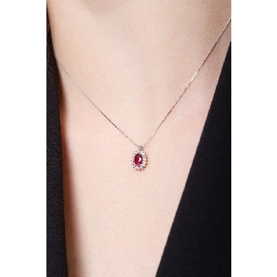 Necklace with oval cut ruby and diamonds