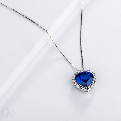 Halo necklace with sapphire and diamond pendant