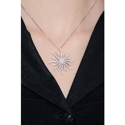 18k rose and white gold sun pendant with diamonds