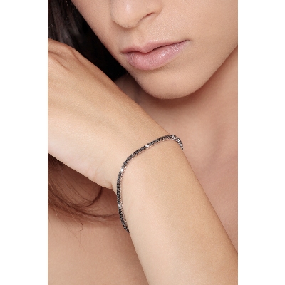 Wire tennis bracelet with black and white round cut diamonds