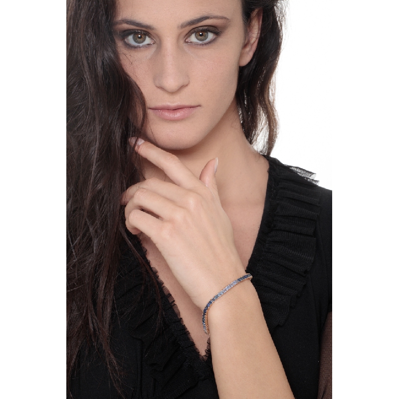 Fancy 18k rose gold tennis bracelet with blue sapphires