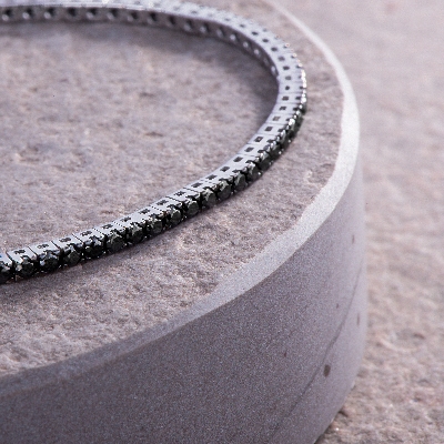 18k white gold tennis bracelet with black diamonds and burnished tips