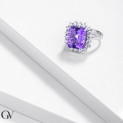 Emerald-cut amethyst diamond halo ring in 18kt white gold