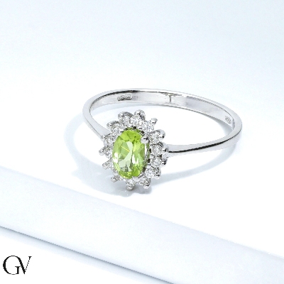 Halo ring in 18k white gold with oval cut peridot and diamonds