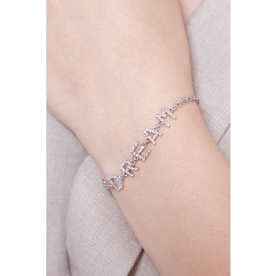 Bracelet with letters DREAM  in white gold and diamonds