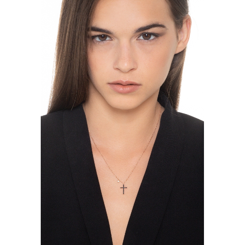 Rose gold 18k pendant with black diamonds cross and a solitaire diamond Rose gold 18k pendant with black diamonds cross and a solitaire diamond