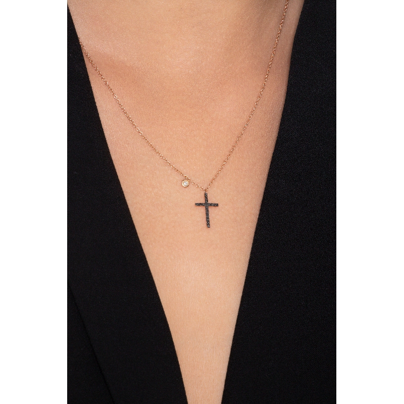 Rose gold 18k pendant with black diamonds cross and a solitaire diamond Rose gold 18k pendant with black diamonds cross and a solitaire diamond