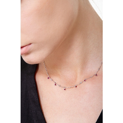 Necklace with diamonds and pear cut ruby charms