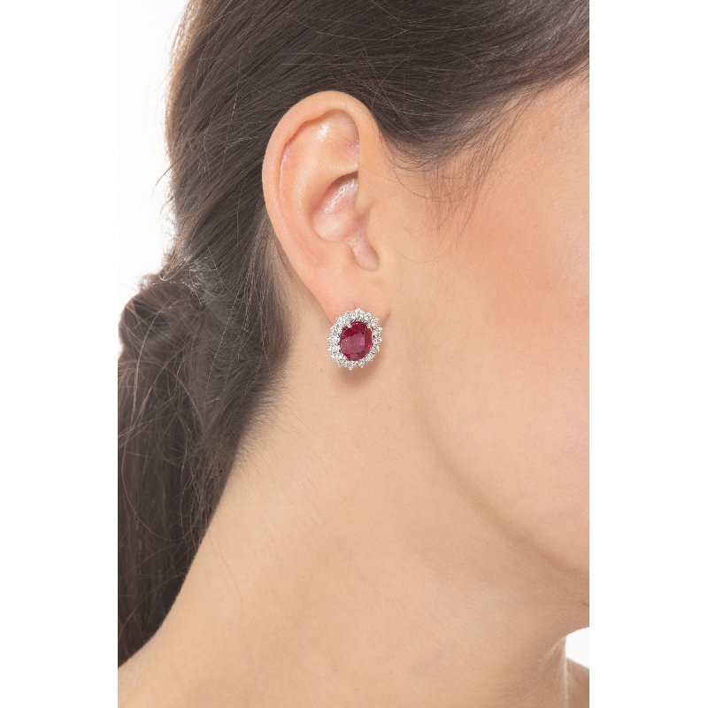 White gold 18k stud earrings with oval cut rubies and diamonds halo  White gold 18k stud earrings with oval cut rubies and diamonds halo