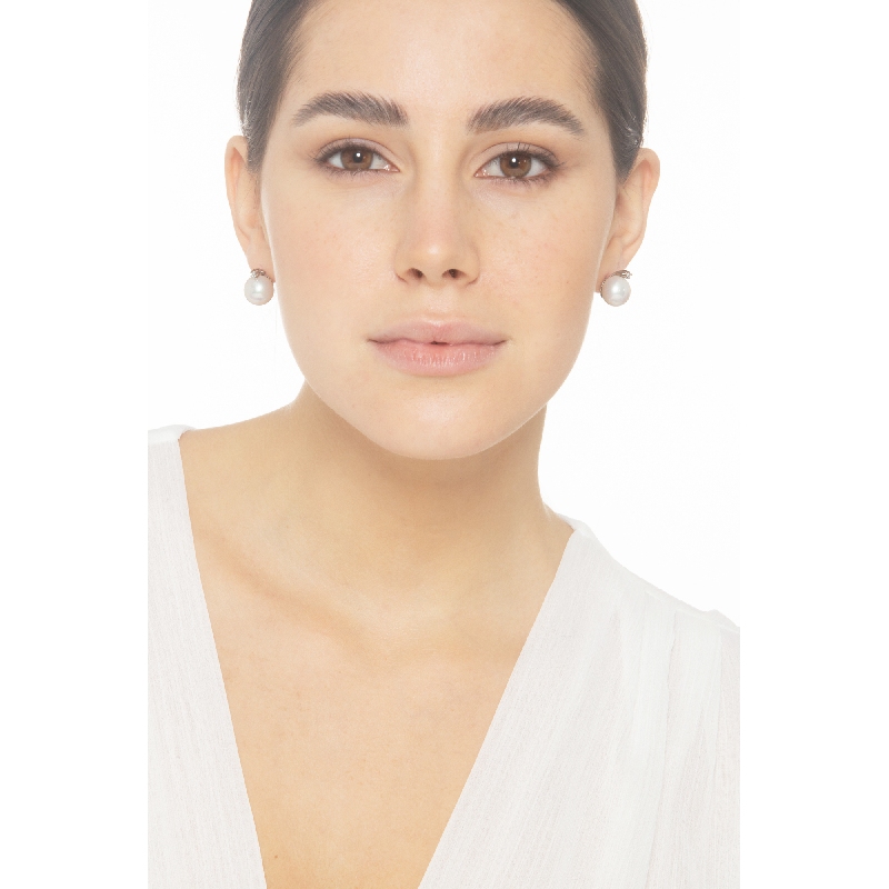 White gold 18k stud earrings with pearls of about 11.50 mm and diamonds 