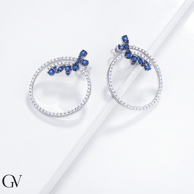 Hoop earrings in white gold 18k with blue sapphires and diamonds Hoop earrings in white gold 18k with blue sapphires and diamonds