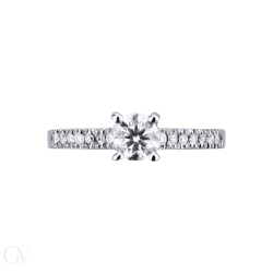 Solitaire setting four prong and diamonds on the shank