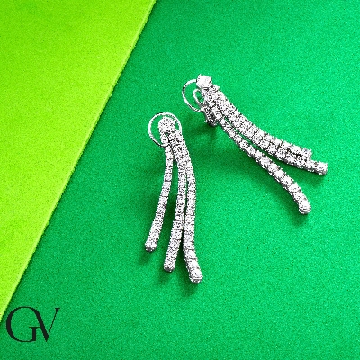 18k white gold triple drop tennis earrings with round cut diamonds
