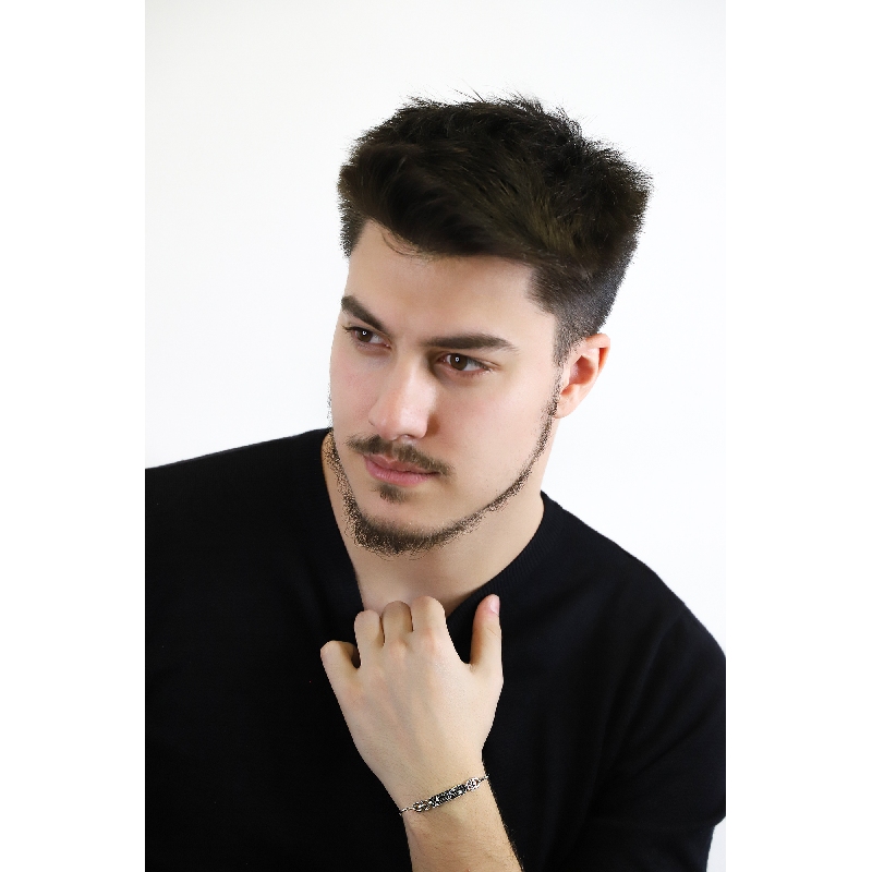 Fancy bracelet in 18k white gold with black and white diamonds Fancy bracelet in 18k white gold with black and white diamonds