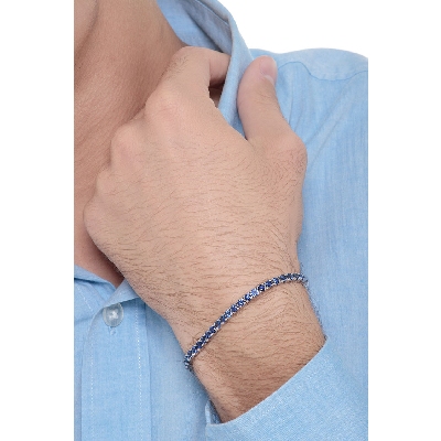 18k white gold tennis bracelet with blue sapphire