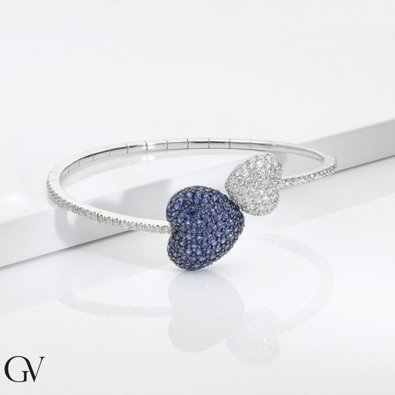 Bracelet in white gold 750 with two hearts in diamonds and blue sapphires Bracelet in white gold 750 with two hearts in diamonds and blue sapphires