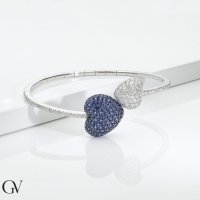 Bracelet in white gold 750 with two hearts in diamonds and blue sapphires