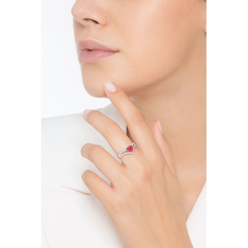 18k white gold ring with a central ruby heart cut and diamonds  18k white gold ring with a central ruby heart cut and diamonds