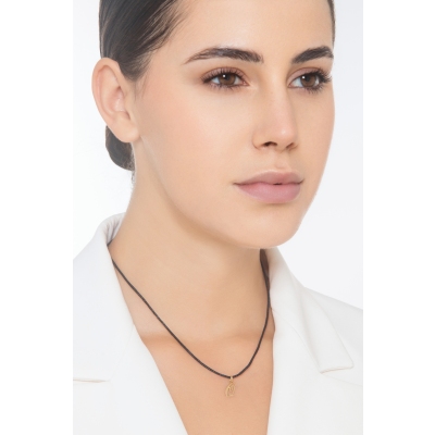 Pendant with initial letter Q in italic in 18k yellow gold