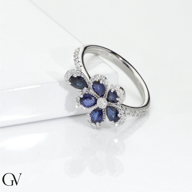 Flower ring in white gold 750 with blue sapphires and diamonds Flower ring in white gold 750 with blue sapphires and diamonds