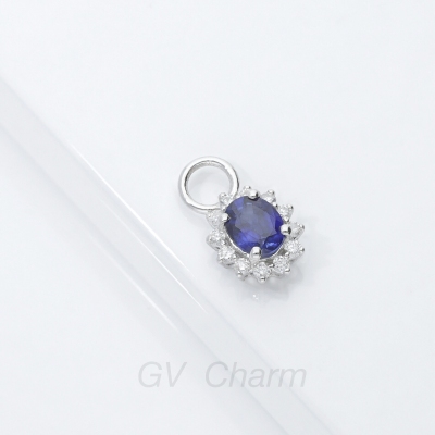 Halo charm with blue sapphire and diamonds