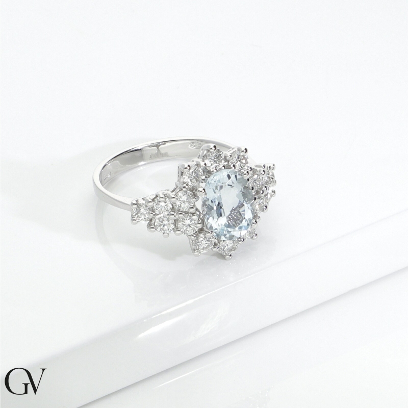 18k white gold halo ring with aquamarine and diamonds 18k white gold halo ring with aquamarine and diamonds