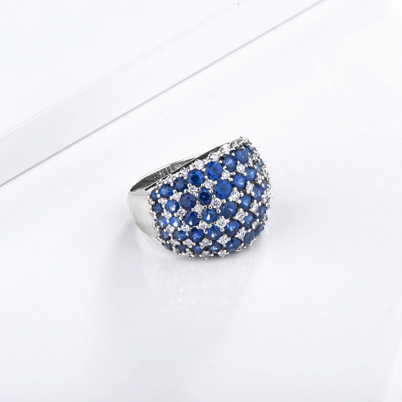 Design ring in white gold 18k with blue sapphires and diamonds