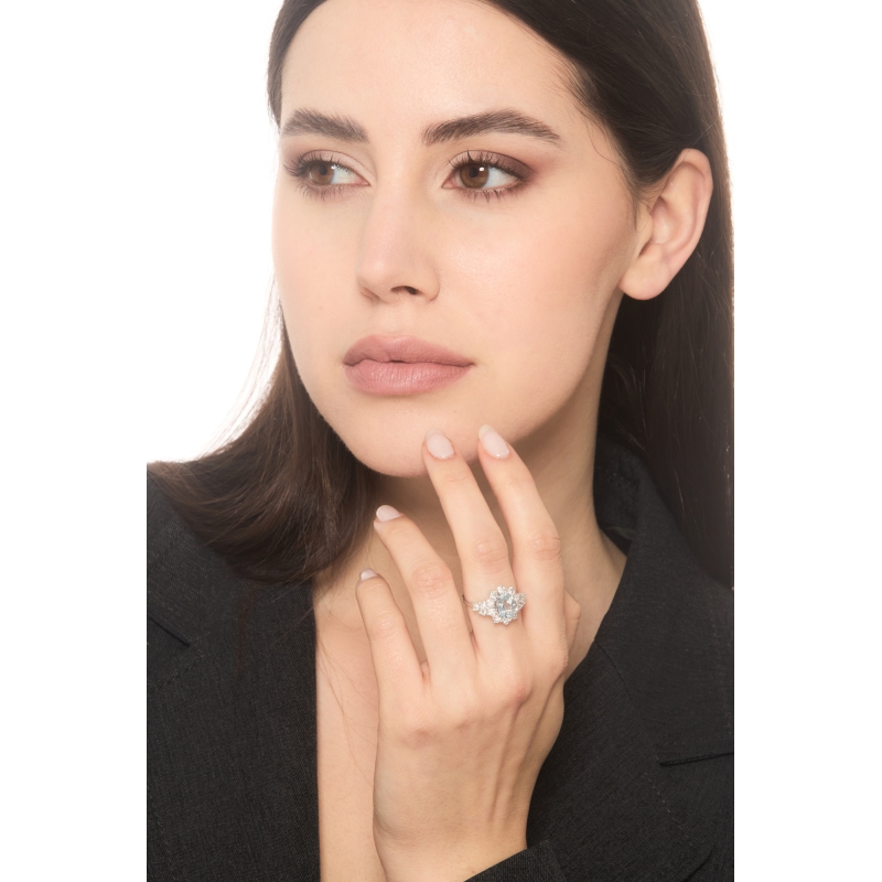 18k white gold halo ring with aquamarine and diamonds 18k white gold halo ring with aquamarine and diamonds