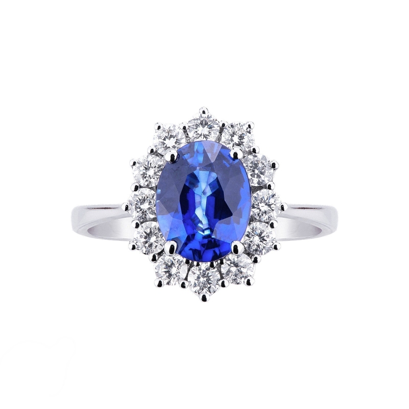 Halo ring with diamonds and blue sapphire oval cut in 18k white gold  Halo ring with diamonds and blue sapphire oval cut in 18k white gold