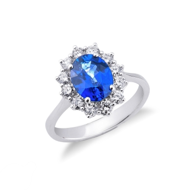 Halo ring with diamonds and blue sapphire oval cut in 18k white gold 
