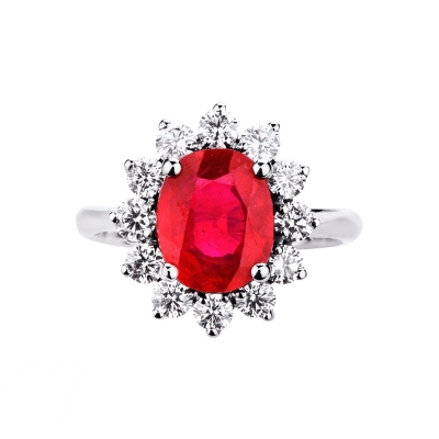 Halo ring with a central oval cut ruby and diamonds white gold 18k