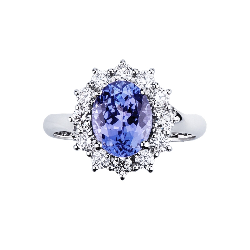 Ring in white gold 18k with central oval tanzanite and halo in diamonds Ring in white gold 18k with central oval tanzanite and halo in diamonds