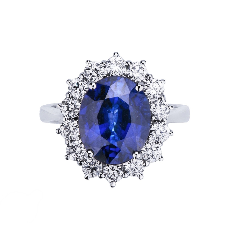 Halo ring in white gold 18k with diamonds and central blue sapphire  Halo ring in white gold 18k with diamonds and central blue sapphire