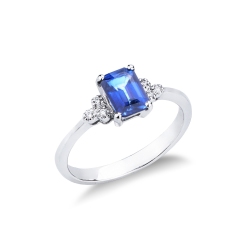 White gold 18k ring with a blue sapphire oval cut and bezel diamonds