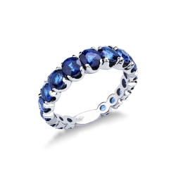 18k white gold half eternity ring with blue sapphires