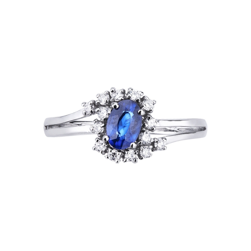 White gold 18k halo ring with diamonds and a central blue sapphire White gold 18k halo ring with diamonds and a central blue sapphire