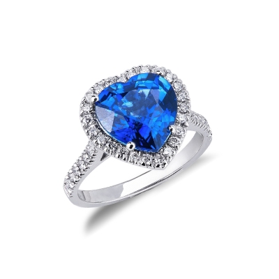 White gold 18k halo ring with a heart cut blue sapphire and diamonds shoulder set