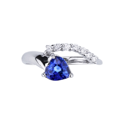 White gold ring with blue sapphire heart cut and a row of diamonds 