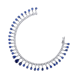 Tennis design bracelet with diamonds and blue sapphires in gold 750