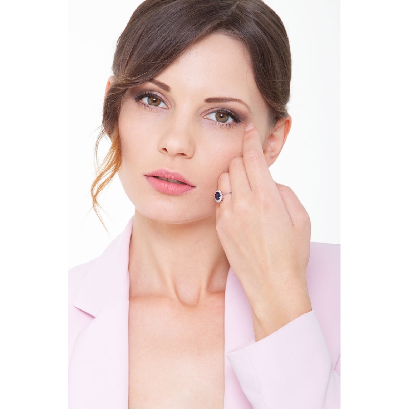 Halo ring white gold 18k with a central blue sapphire and diamonds  Halo ring white gold 18k with a central blue sapphire and diamonds