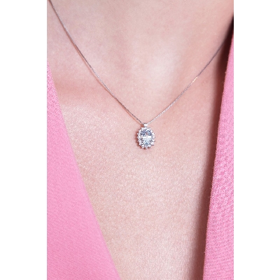 Necklace with oval aquamarine and diamond pendant